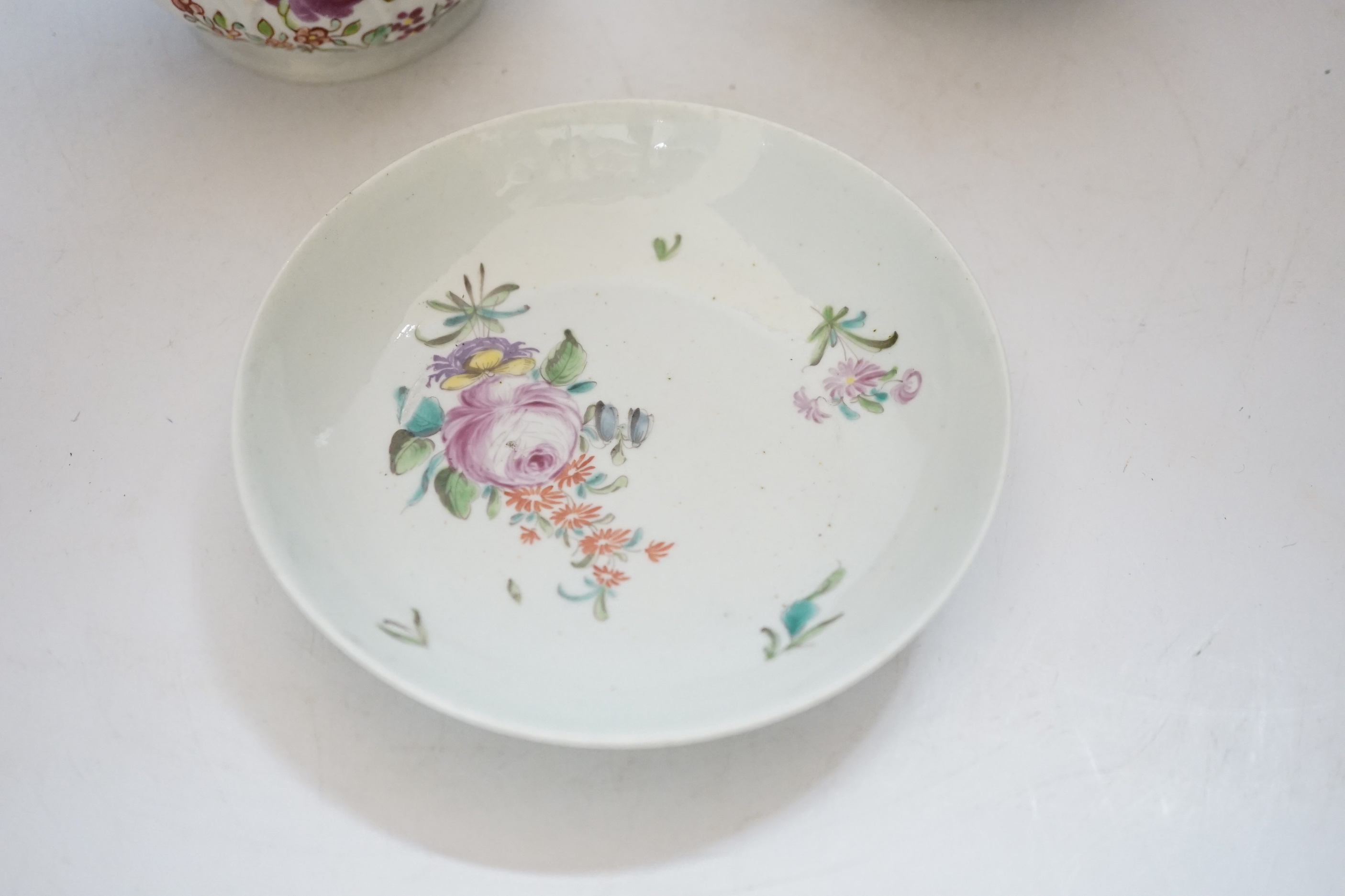 A Chaffers Liverpool saucer, c.1760 and two 18th century Christian or Pennington sauceboats, saucer 12cm diameter